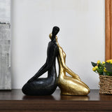 Sitting Couple Decorative Polyresin Showpiece (Black & Gold)