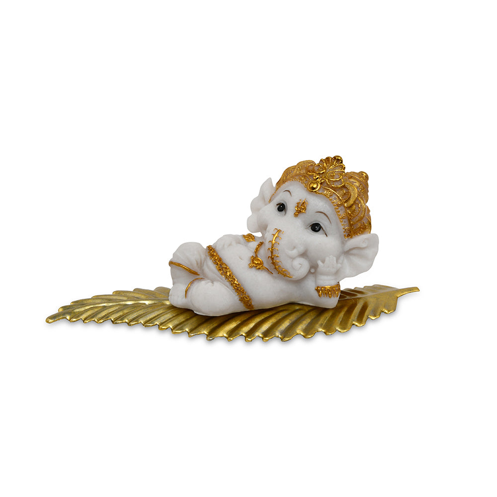 Ganesha On Leaf Polyresin Showpiece (White & Gold)