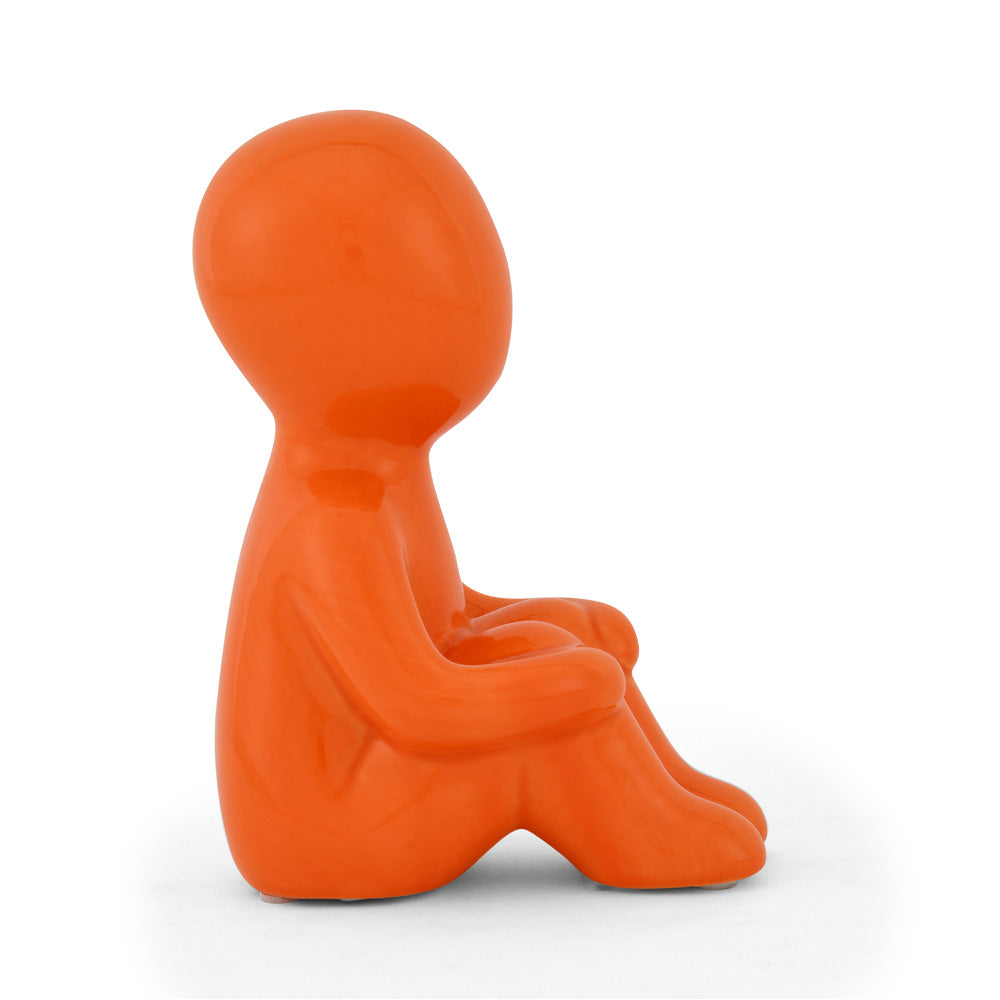 Boy Sitting with Folded Legs Polyresin Decorative Showpiece (Orange)