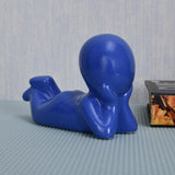 Boy Resting Polyresin Decorative Showpiece (Blue)