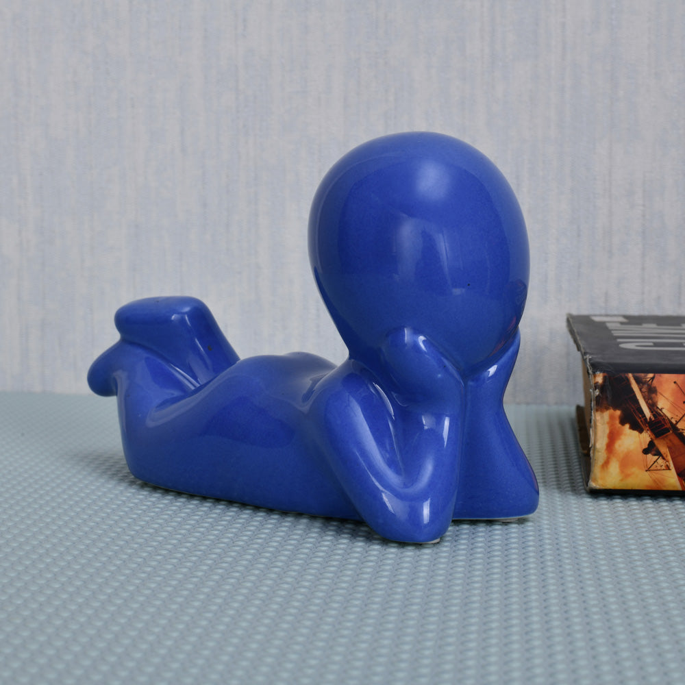 Boy Resting Polyresin Decorative Showpiece (Blue)